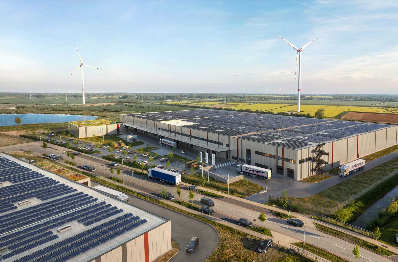 Aerial view of the logistics hall Hansalinie Bremen - Onebox. A large warehouse with solar cells on the entire roof.